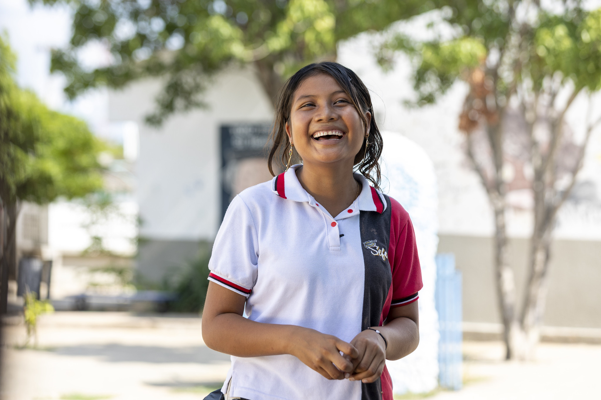 A young woman smiling outdoors in Colombia