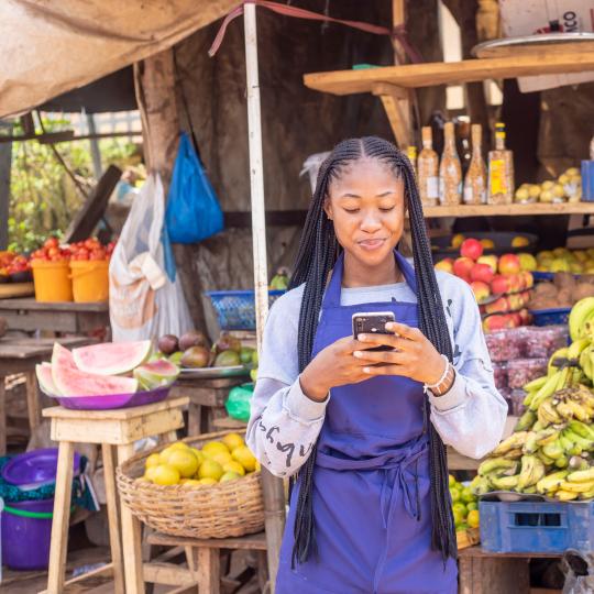 WSSD2 Solutions Session Woman on her phone in Africa