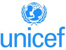 Display of UNICEF logo which features silhouette of mother holding up an infant.