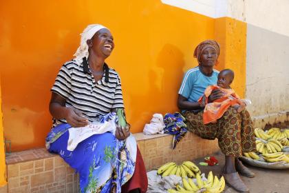 Women workers Women and a baby sitting together in rural Africa